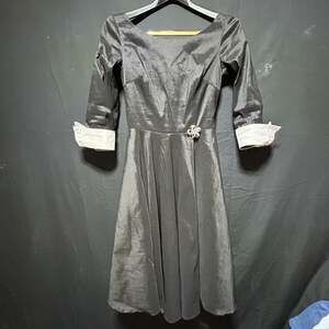 Unique Vintage Black Shimmer Satin Tea-Length Dress with Bow Brooch and White Cu